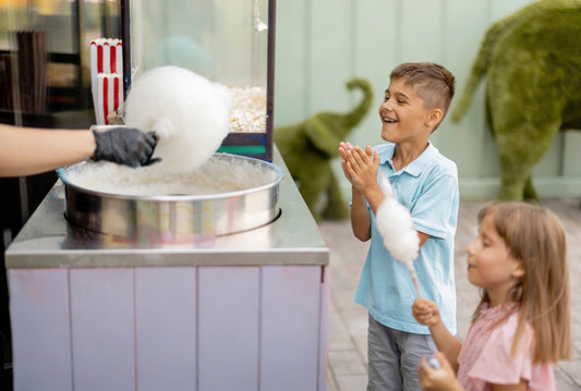 Boy and girl watching spinning cotton candy